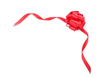 Photo of Red satin ribbon with bow on white background, top view