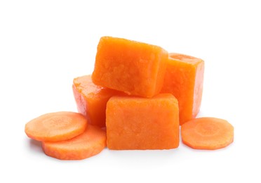 Frozen carrot puree cubes and fresh carrot isolated on white