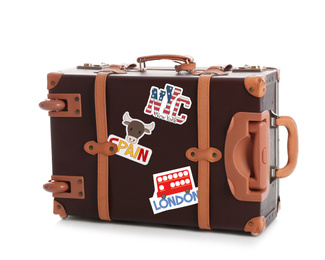 Image of Retro suitcase with travel stickers on white background