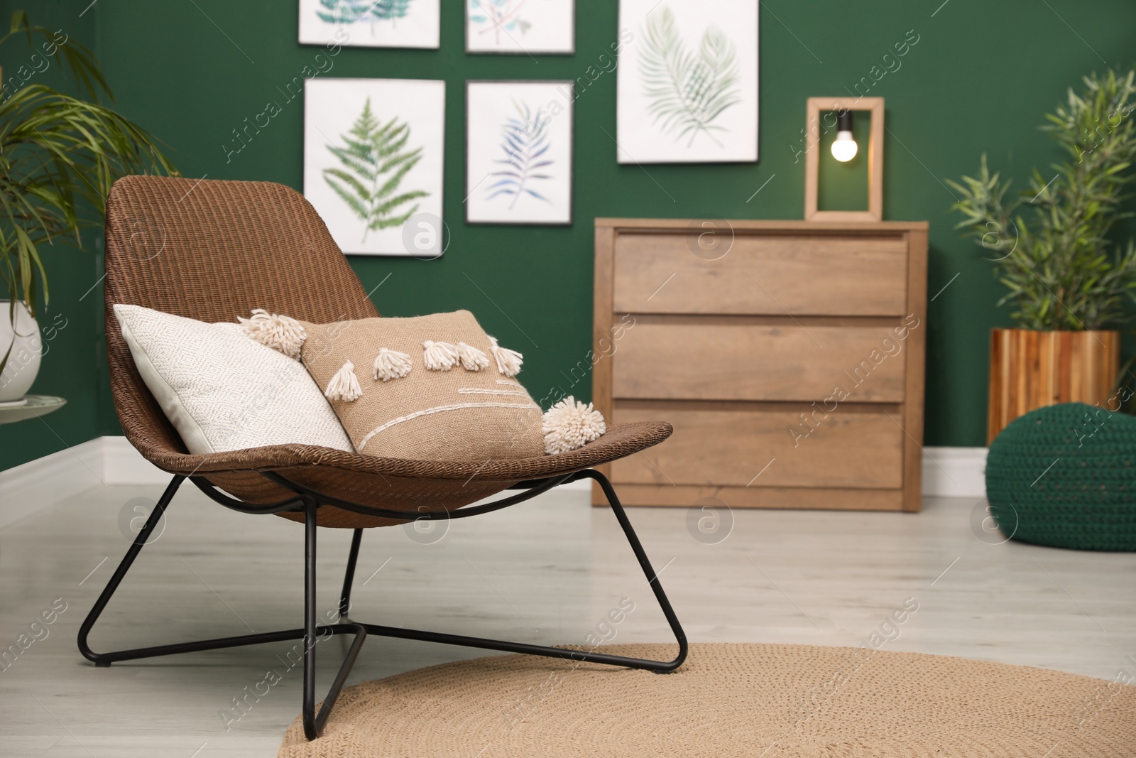 Photo of Elegant room interior with comfortable wicker armchair