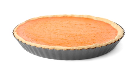 Photo of Delicious homemade pumpkin pie in metal pan isolated on white