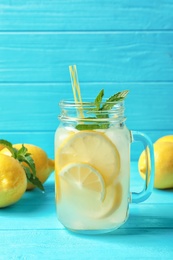 Natural lemonade in mason jar on wooden table