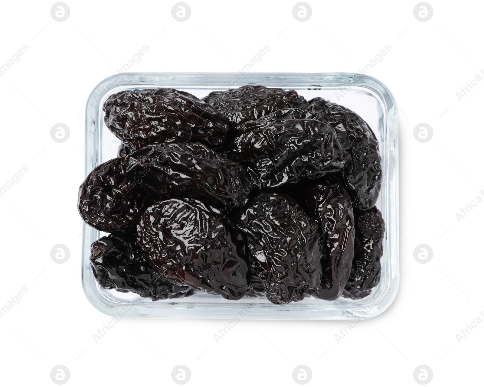 Photo of Bowl with sweet dried prunes isolated on white, top view