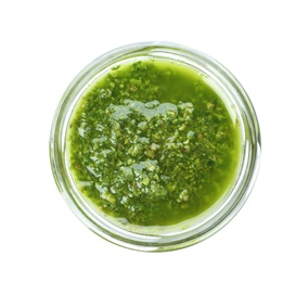 Photo of Homemade basil pesto sauce in glass jar on white background, top view