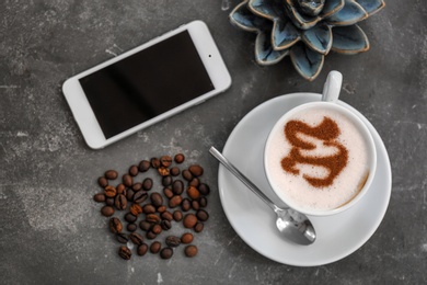 Photo of Cup of fresh aromatic coffee on table, top view