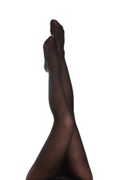 Woman with beautiful long legs wearing black tights on white background, closeup