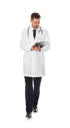 Full length portrait of male doctor with clipboard isolated on white. Medical staff