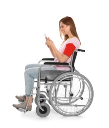 Beautiful woman in wheelchair using mobile phone isolated on white