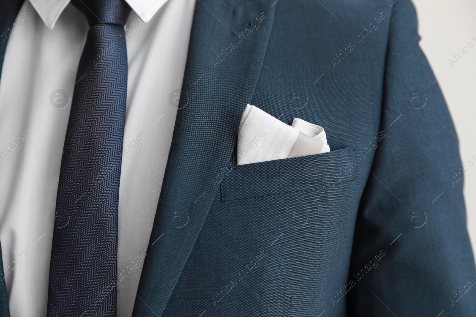 Photo of Man with handkerchief in suit pocket, closeup view