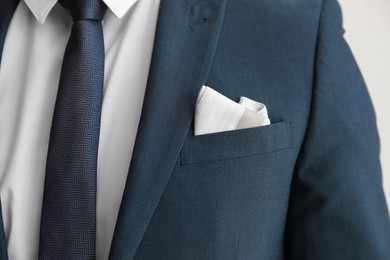 Photo of Man with handkerchief in suit pocket, closeup view