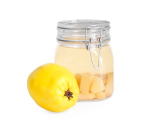 Photo of Delicious quince drink in glass jar and fresh fruit isolated on white