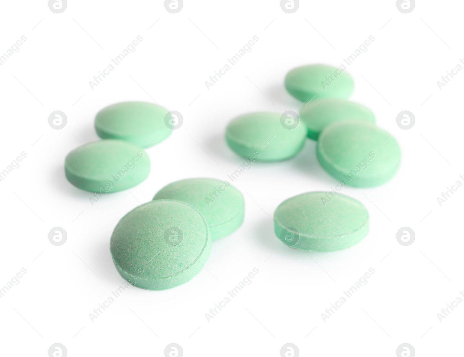 Photo of Many light green pills isolated on white