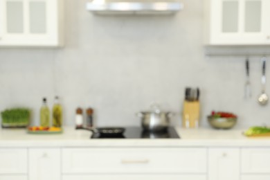 Photo of Blurred view of modern kitchen. Interior design