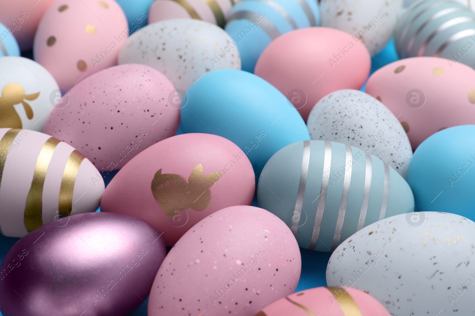 Photo of Many painted Easter eggs as background, closeup