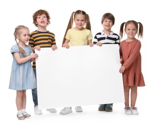 Photo of Group of children with blank poster on white background. Mockup for design