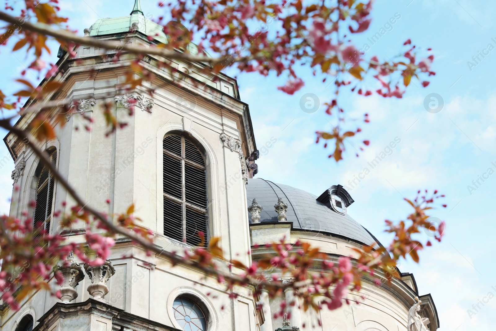 Photo of Exterior of beautiful cathedral against blue sky, low angle view