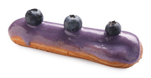 Delicious eclair decorated with blueberries isolated on white