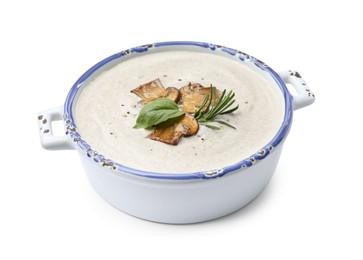 Fresh homemade mushroom soup in ceramic pot isolated on white