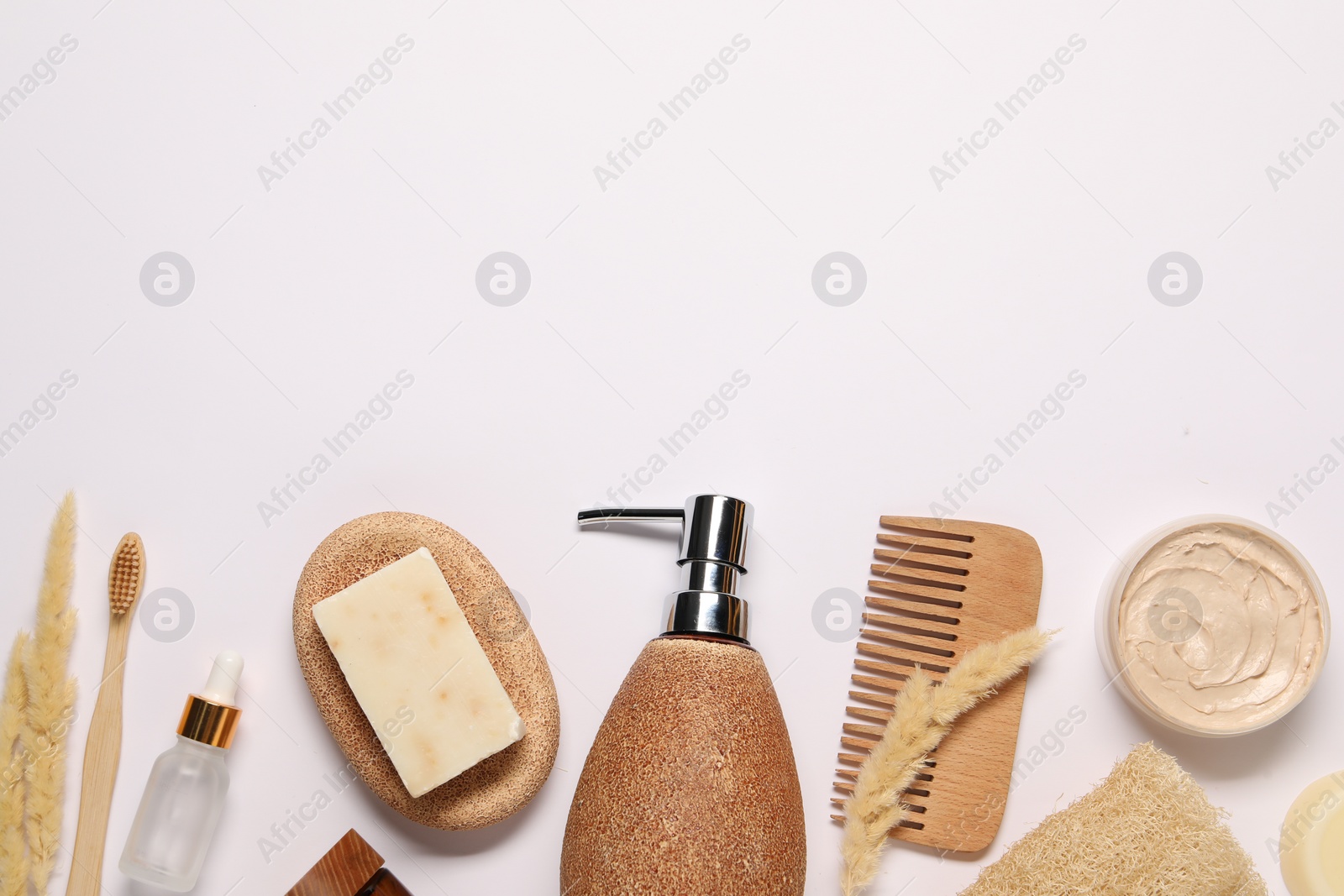 Photo of Bath accessories. Different personal care products and dry spikelets on white background, flat lay with space for text