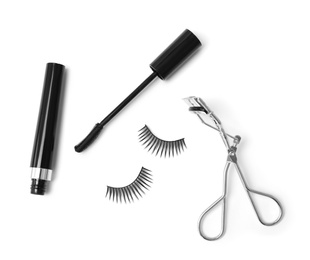 False eyelashes, mascara and curler on white background