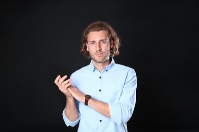 Portrait of handsome man on black background