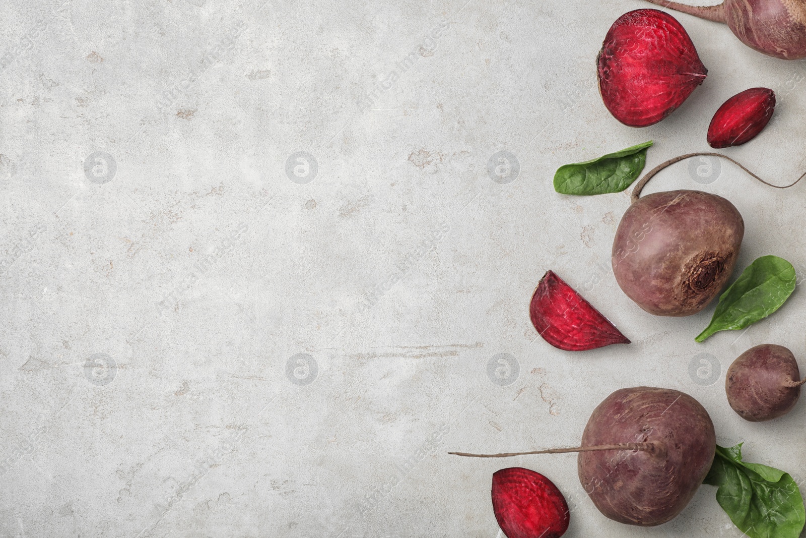 Photo of Flat lay composition with ripe beets on grey background