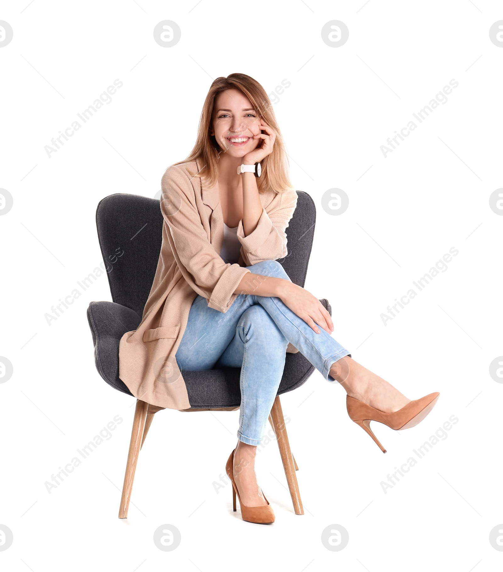 Photo of Young woman sitting in armchair on white background