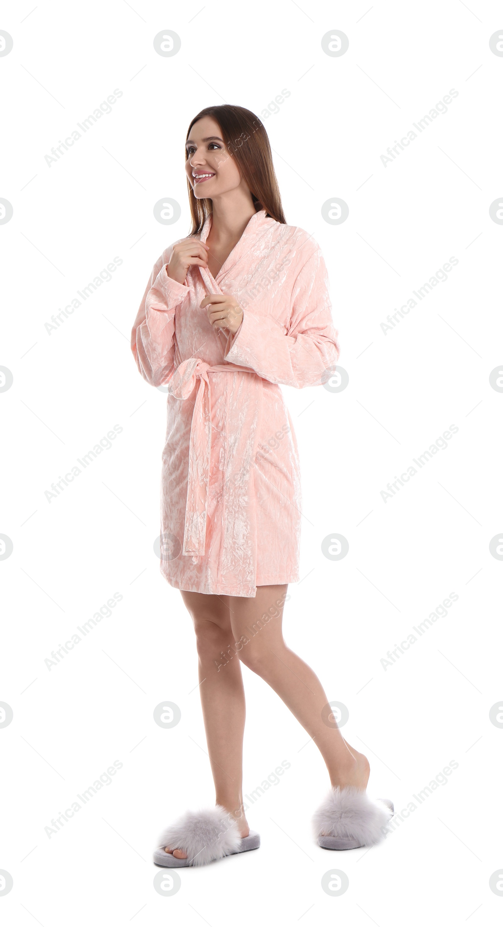 Photo of Young woman in bathrobe on white background