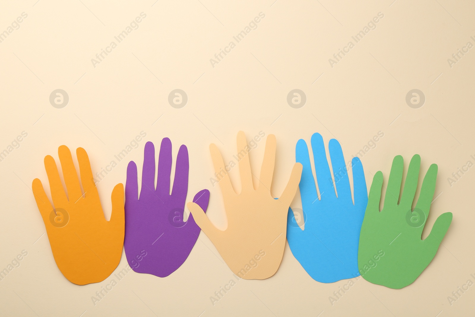 Photo of Equality concept. Different paper palms on beige background, flat lay. Space for text