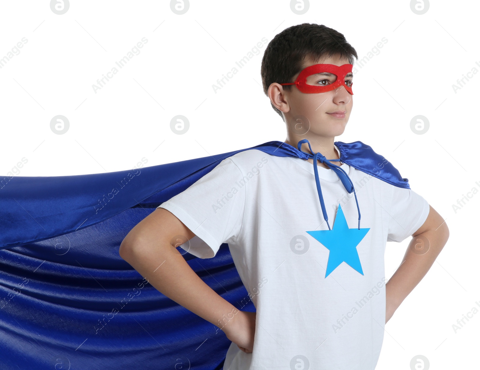 Photo of Teenage boy in superhero costume on white background