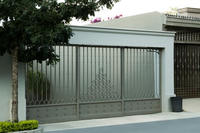 Beautiful closed metal gate and fence outdoors