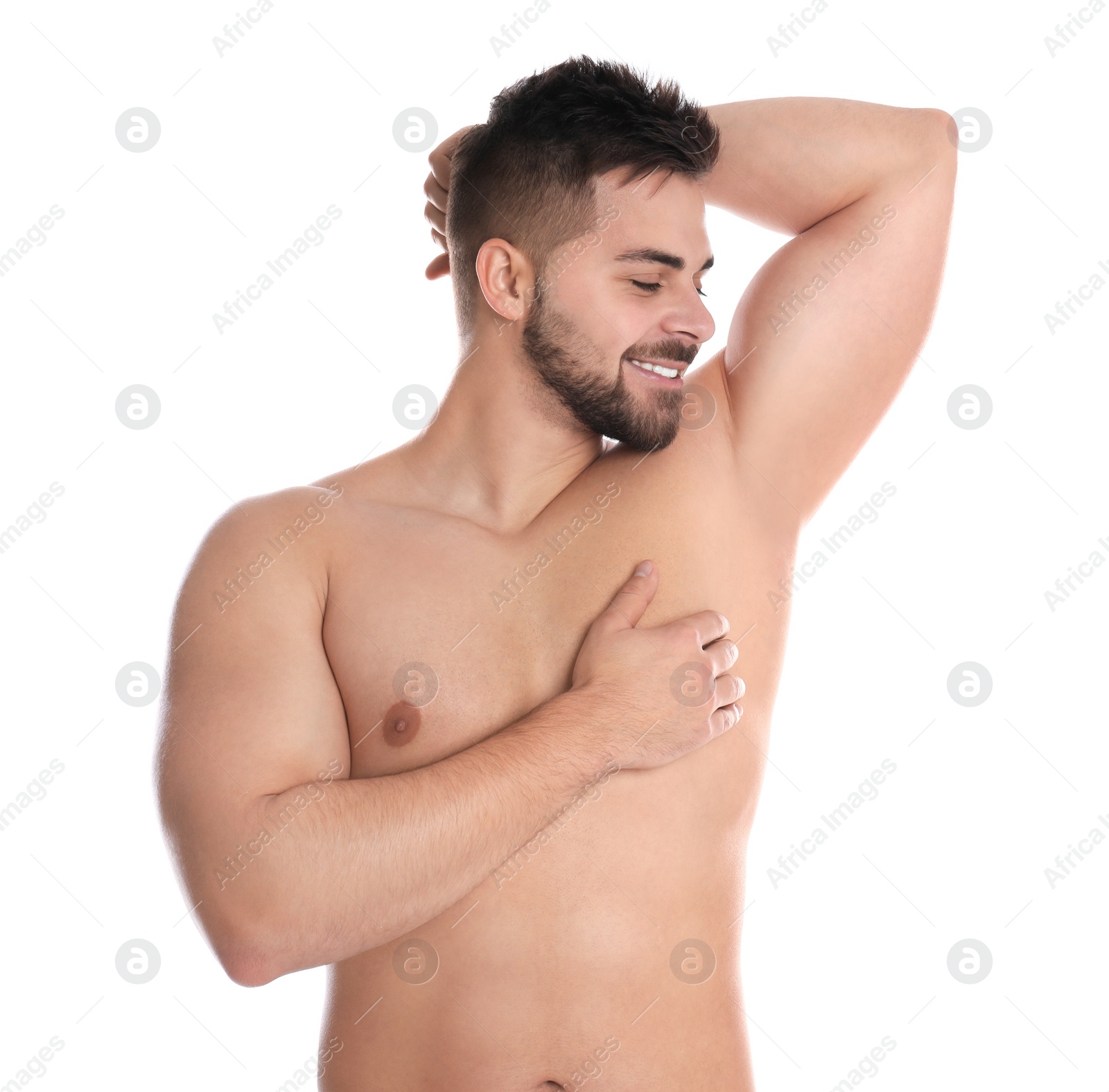 Photo of Young man showing hairless armpit after epilation procedure on white background