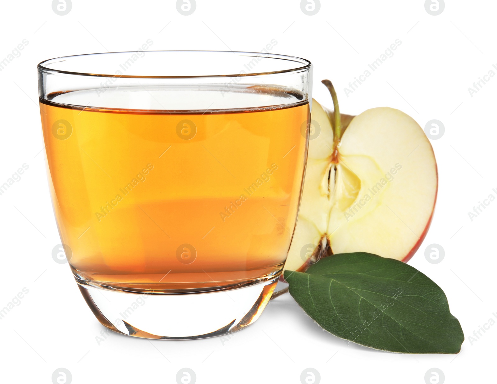 Photo of Glass with delicious cider, piece of ripe apple and leaf on white background