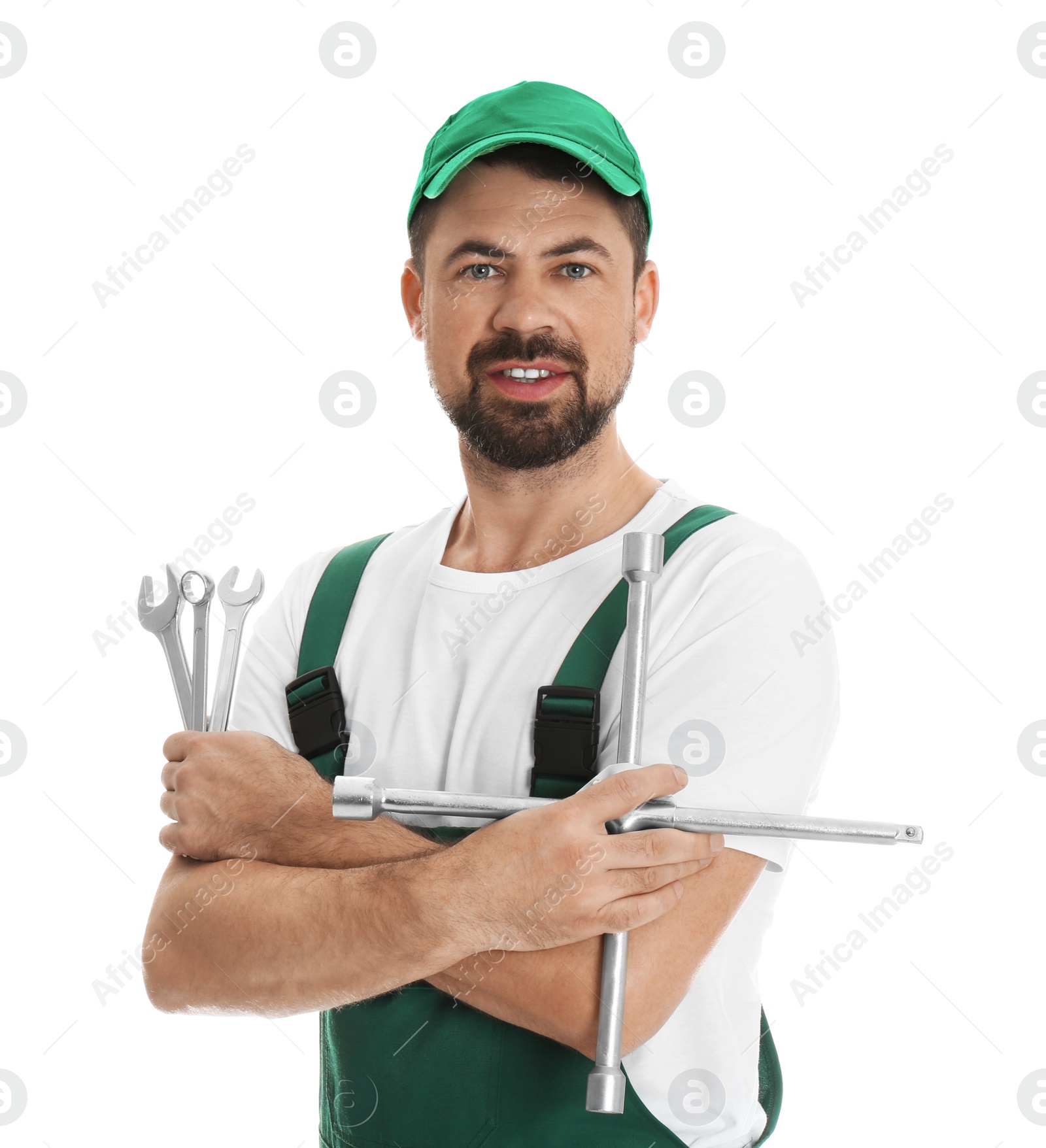 Photo of Portrait of professional auto mechanic with wrenches on white background