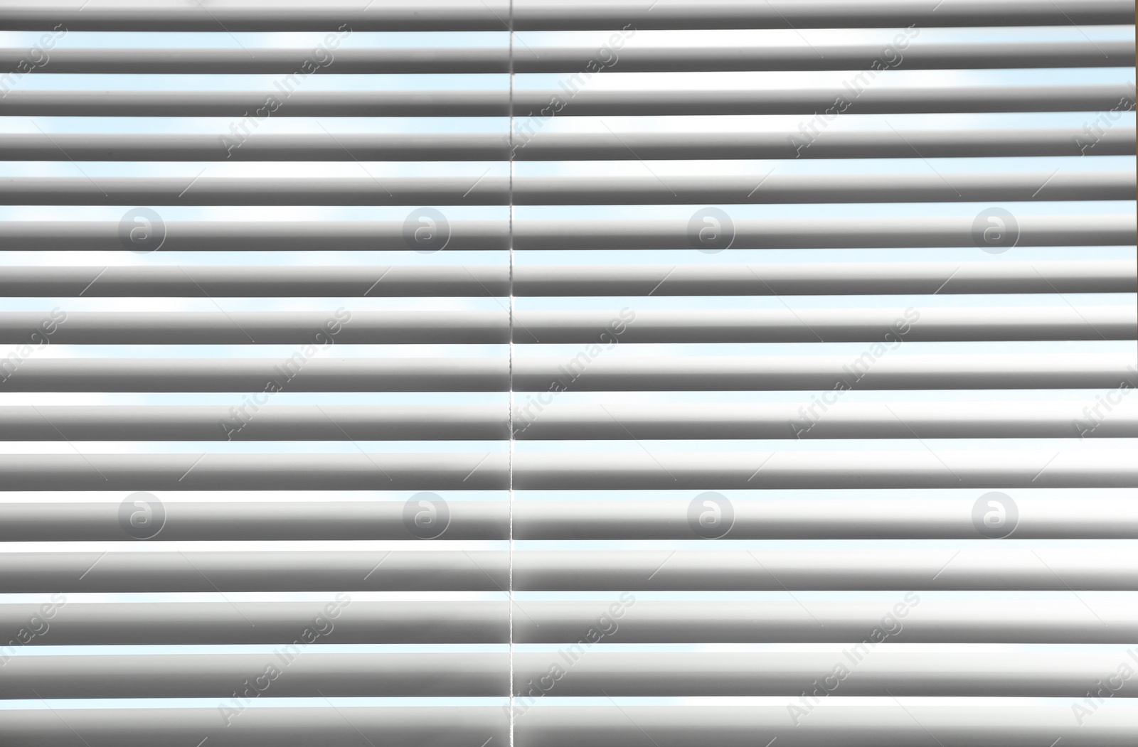 Photo of Closeup view of window with horizontal blinds