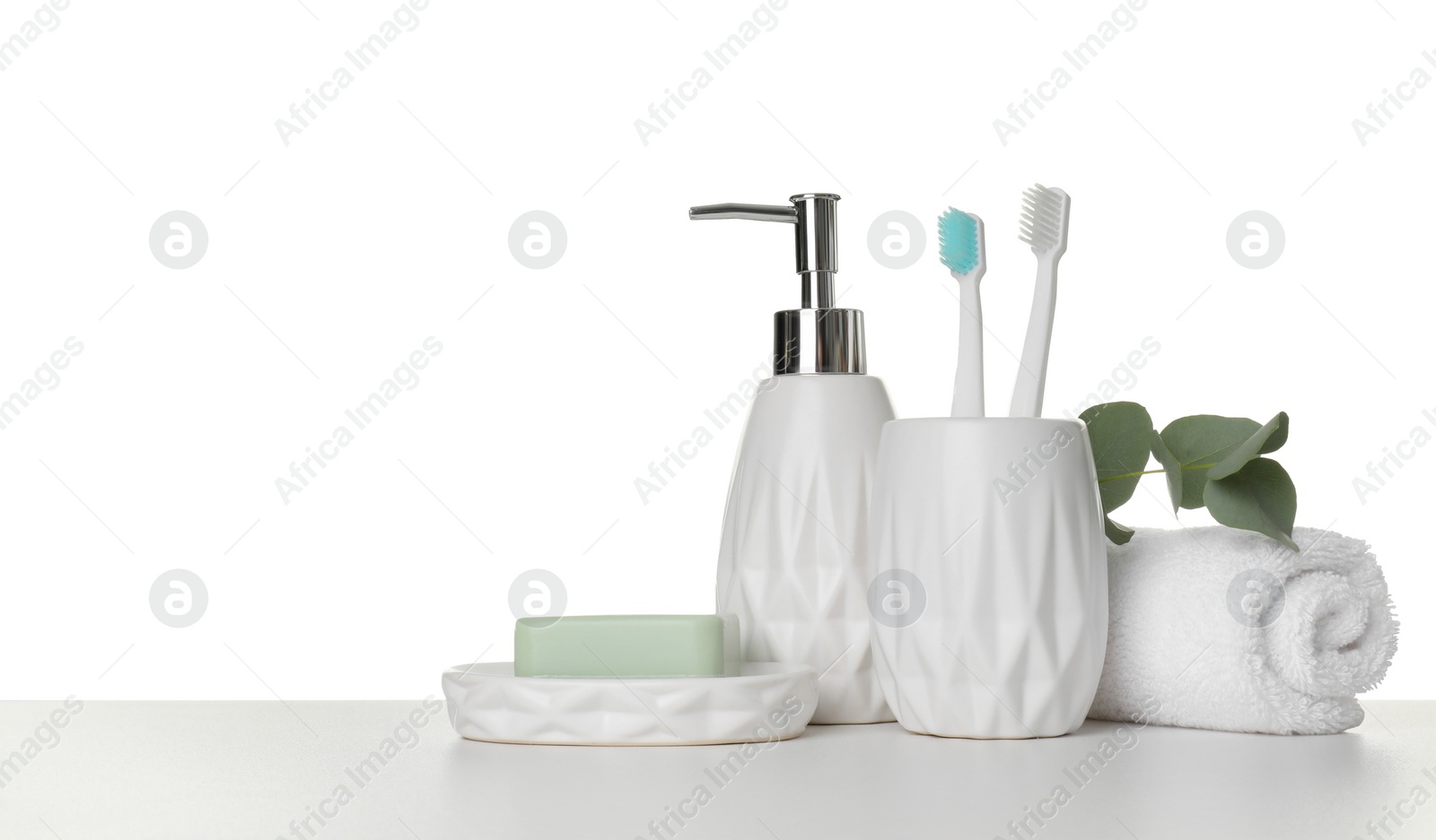 Photo of Bath accessories. Different personal care products and eucalyptus branch on table against white background. Space for text