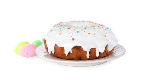 Photo of Easter cake with sprinkles and painted eggs isolated on white