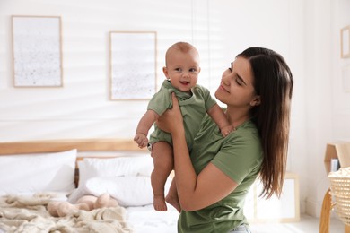 Mother with her cute baby at home