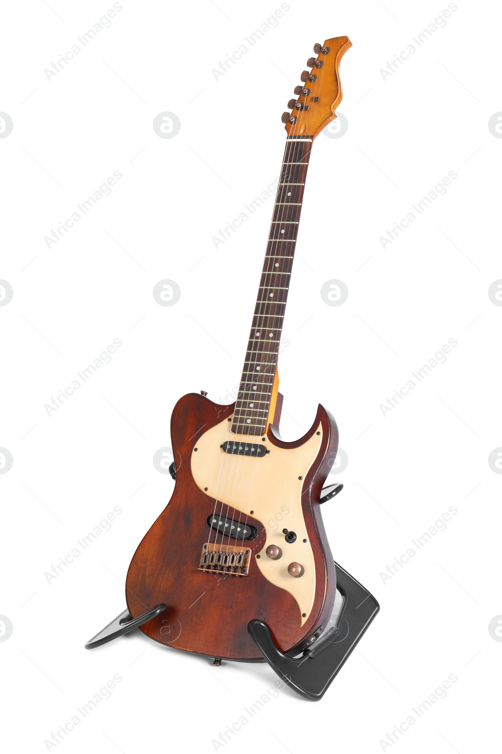 Photo of Electric guitar on stand against white background