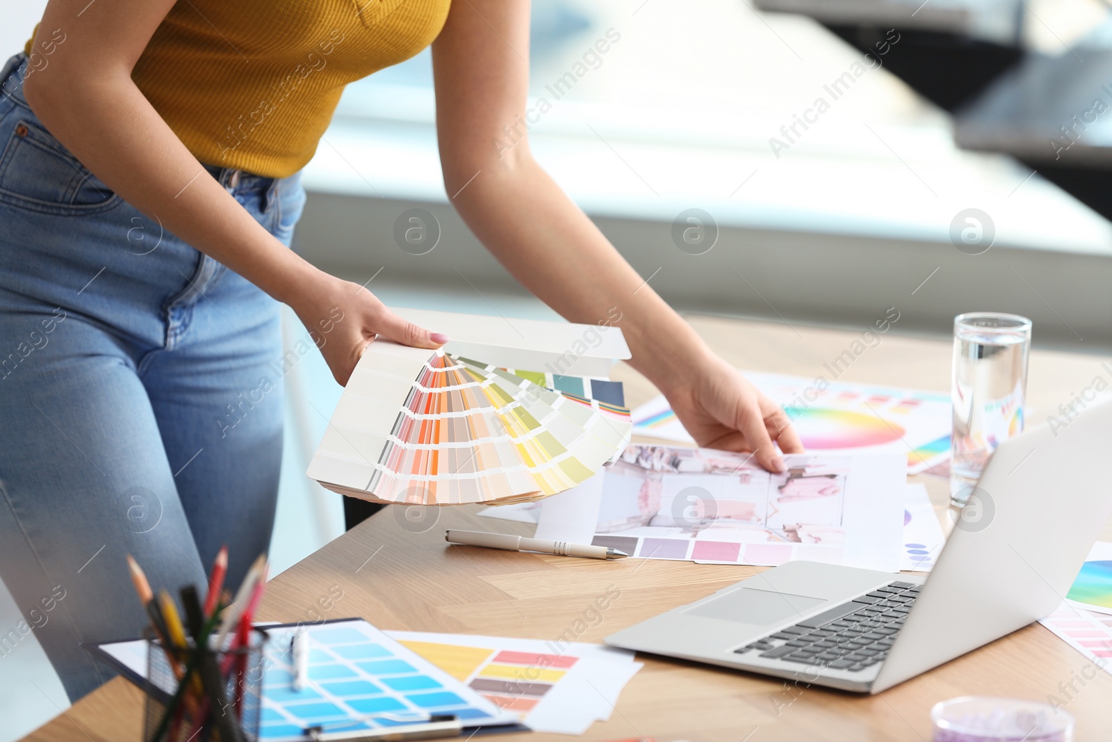 Photo of Professional interior designer at workplace in office, closeup