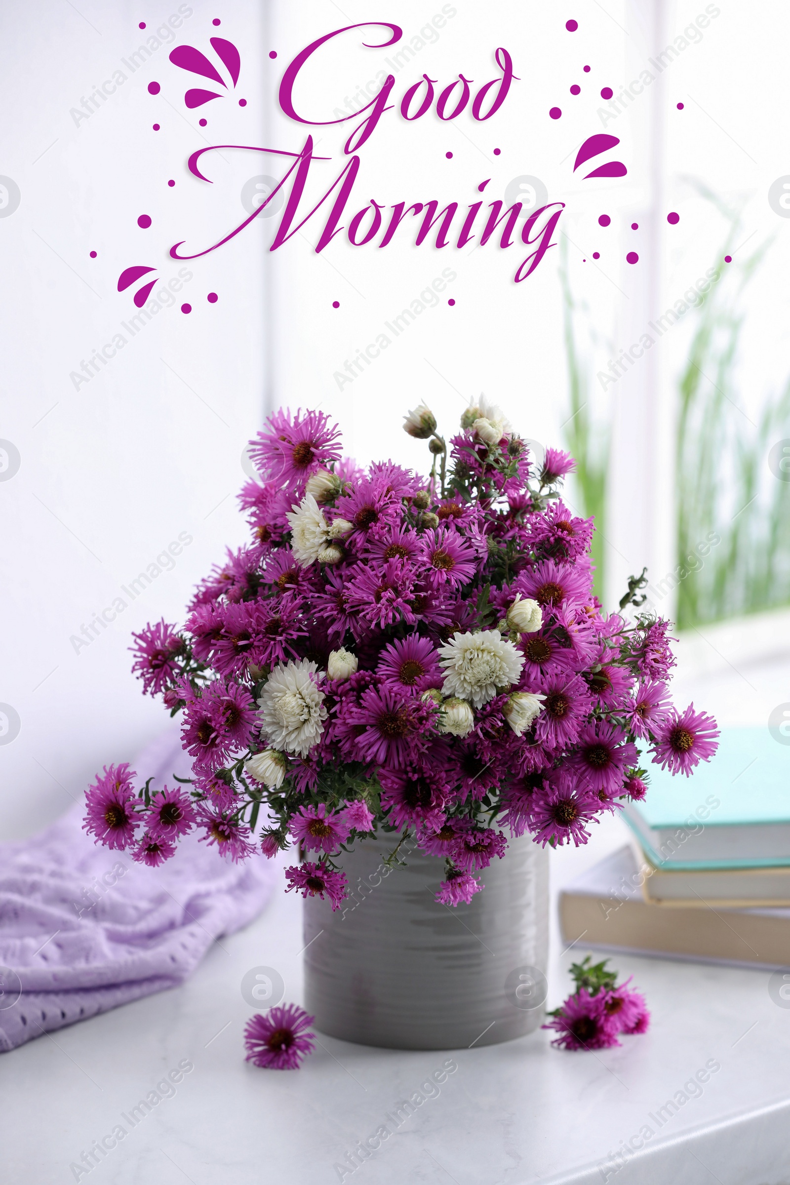 Image of Good morning! Beautiful flowers, books and violet cloth on white table