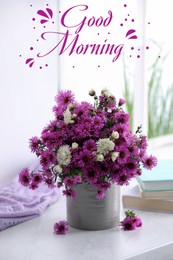 Good morning! Beautiful flowers, books and violet cloth on white table