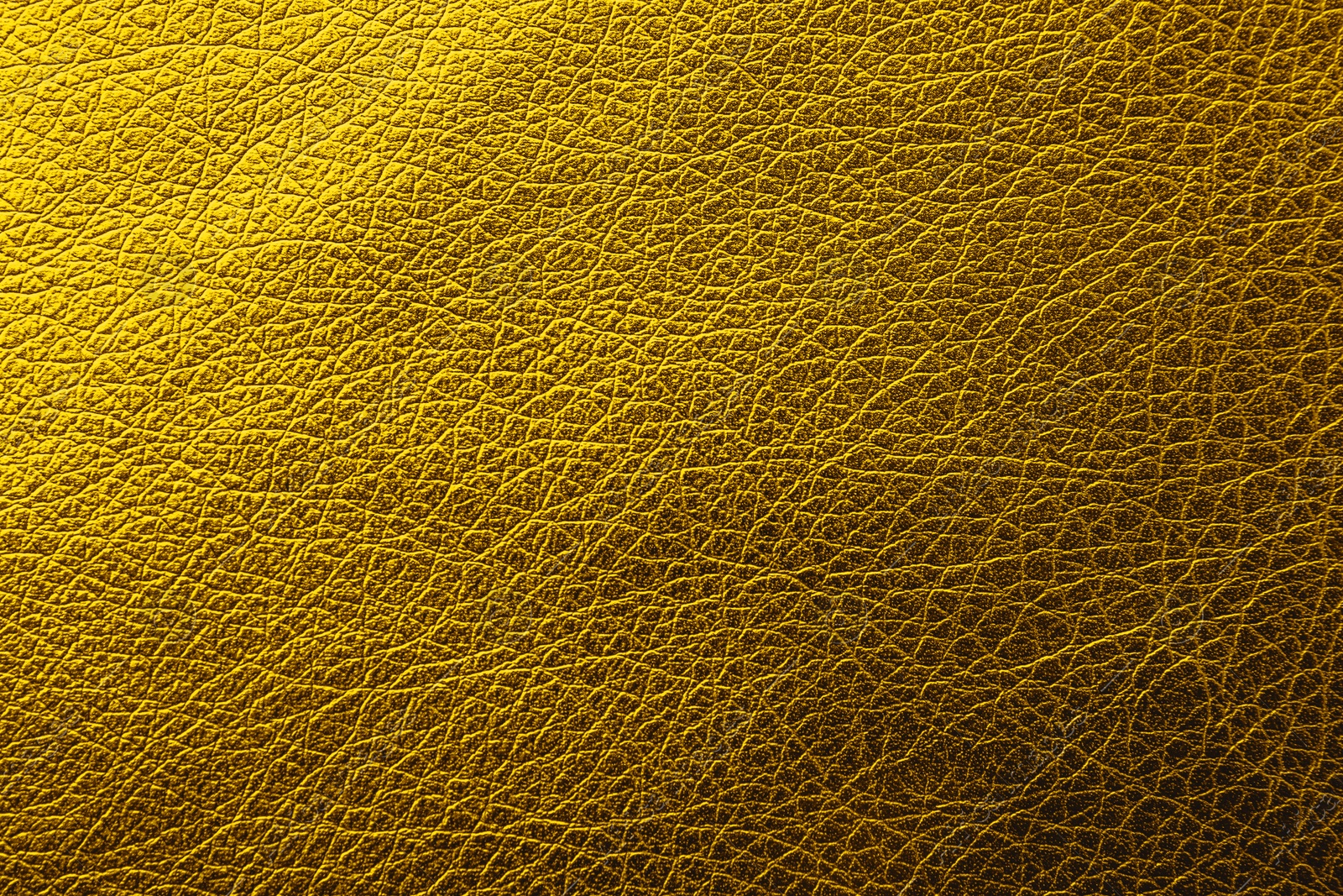 Image of Golden textured surface as background, closeup view