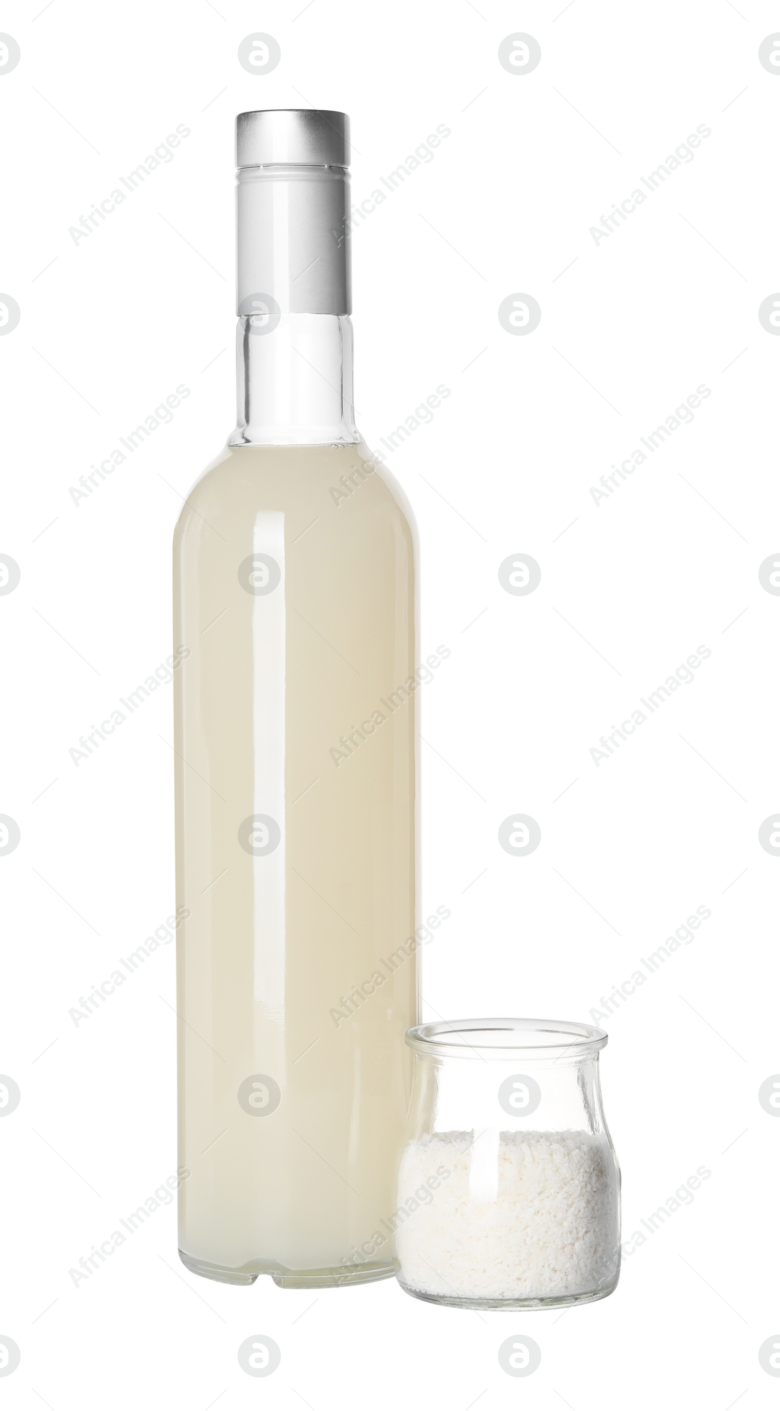 Photo of Delicious syrup for coffee and coconut flakes on white background