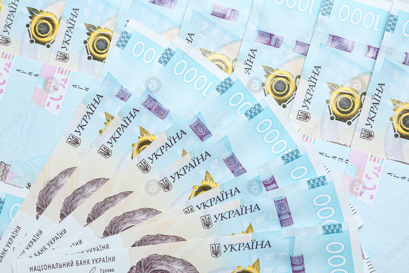 Photo of Closeup view of Ukrainian money as background. National currency