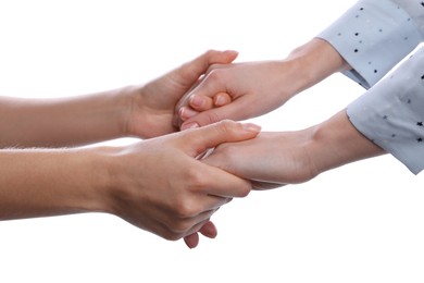 Women holding hands on white background, closeup