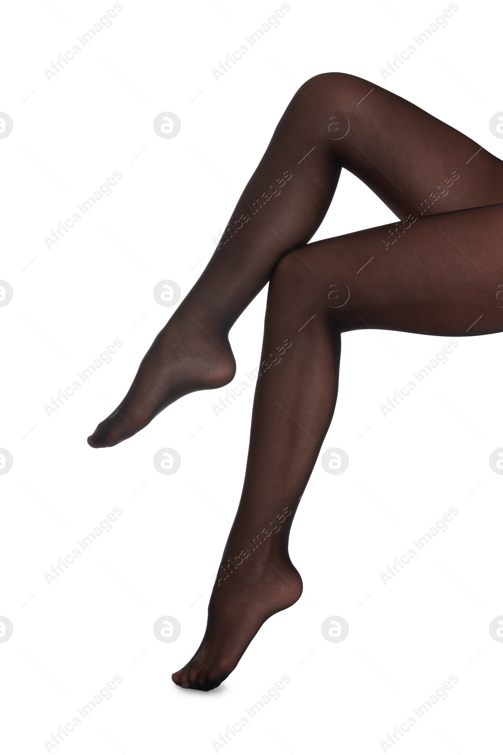 Photo of Woman with beautiful long legs wearing black tights on white background, closeup