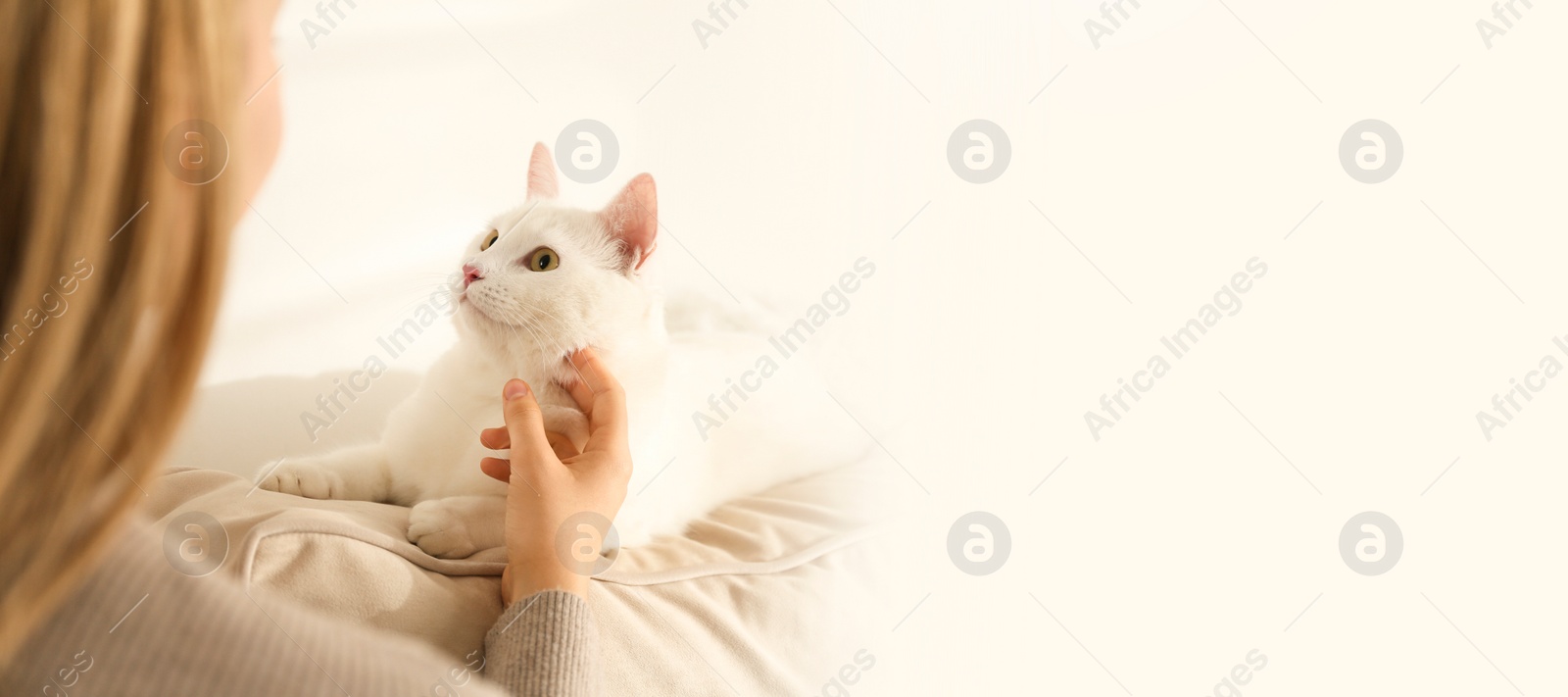 Image of Young woman with her beautiful pet at home, space for text. Banner design
