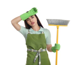 Photo of Tired young woman with broom on white background