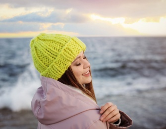 Photo of Portrait of beautiful young woman near sea